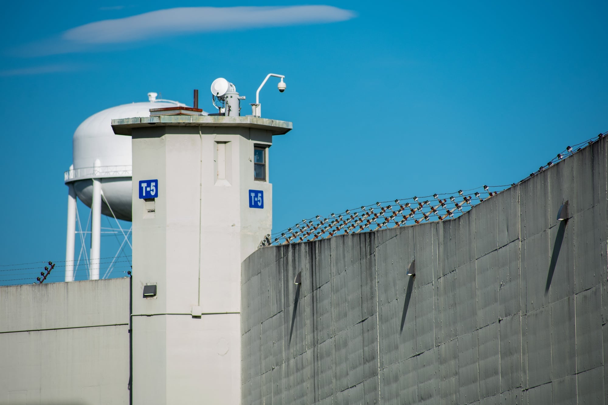 One of MCI-Cedar Junction's 10 guard towers can be seen from the road.