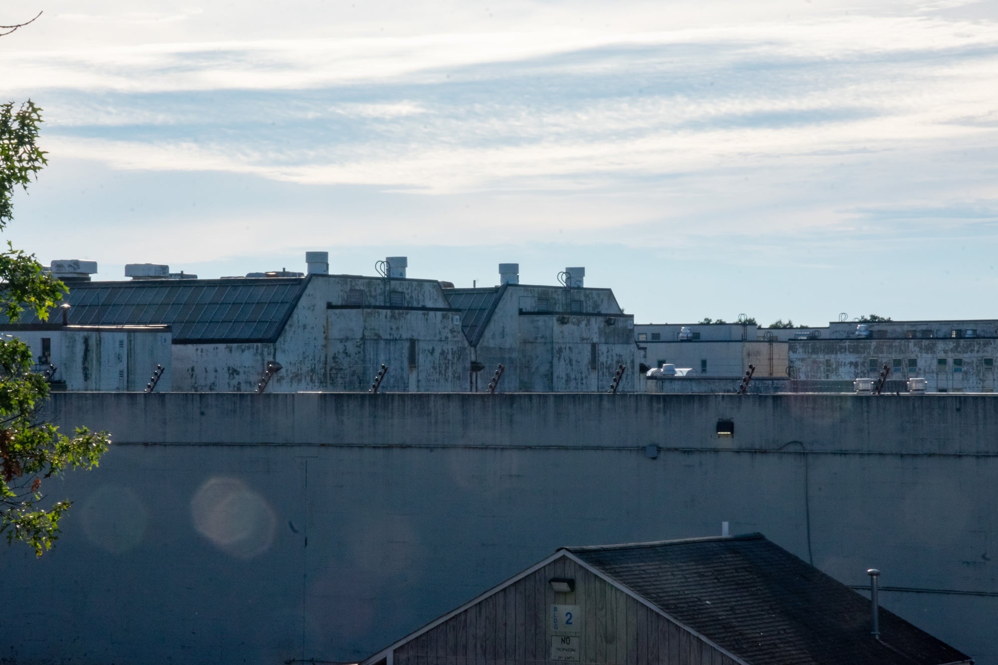 An overpass on Route 1A looks over the walls of Cedar Junction and into the vast complex within.