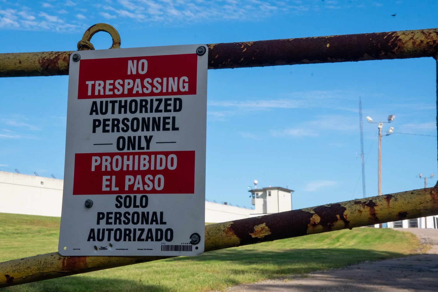 A "No trespassing" sign hangs on a gate to the entrance of Cedar Junction. The Department of Correction has yet to announce what will be done with the building now that all of the men incarcerated there have been relocated.