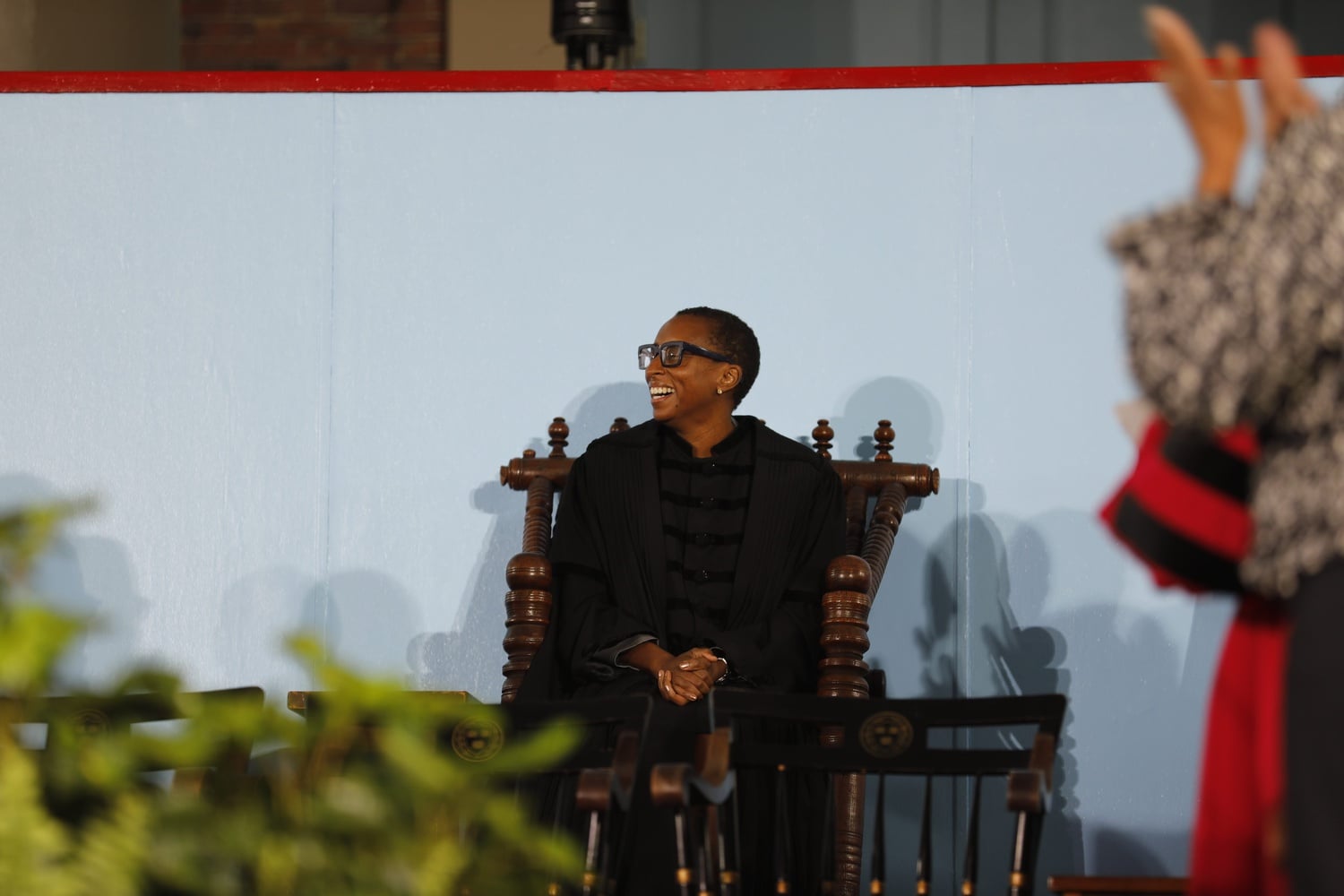 Harvard President Claudine Gay takes her seat in the notoriously uncomfortable Holyoke Chair, one of several time-honored inauguration traditions.