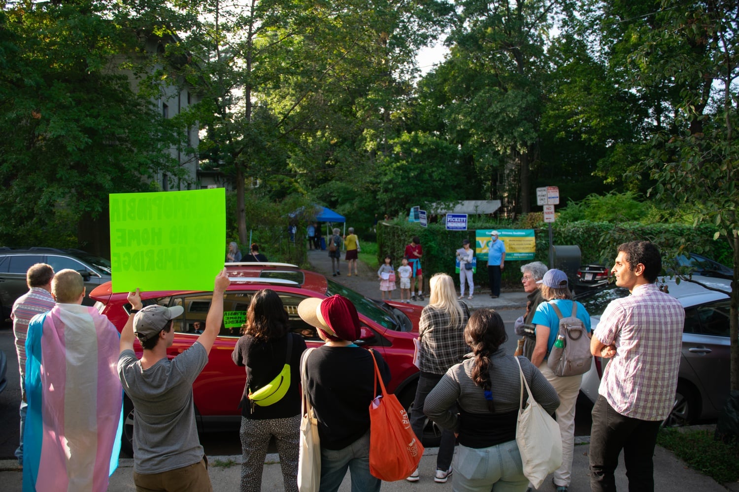 Protesters hold signs and chant across the street from the Cambridge Citizens Coalition endorsement celebration on Oct. 1.