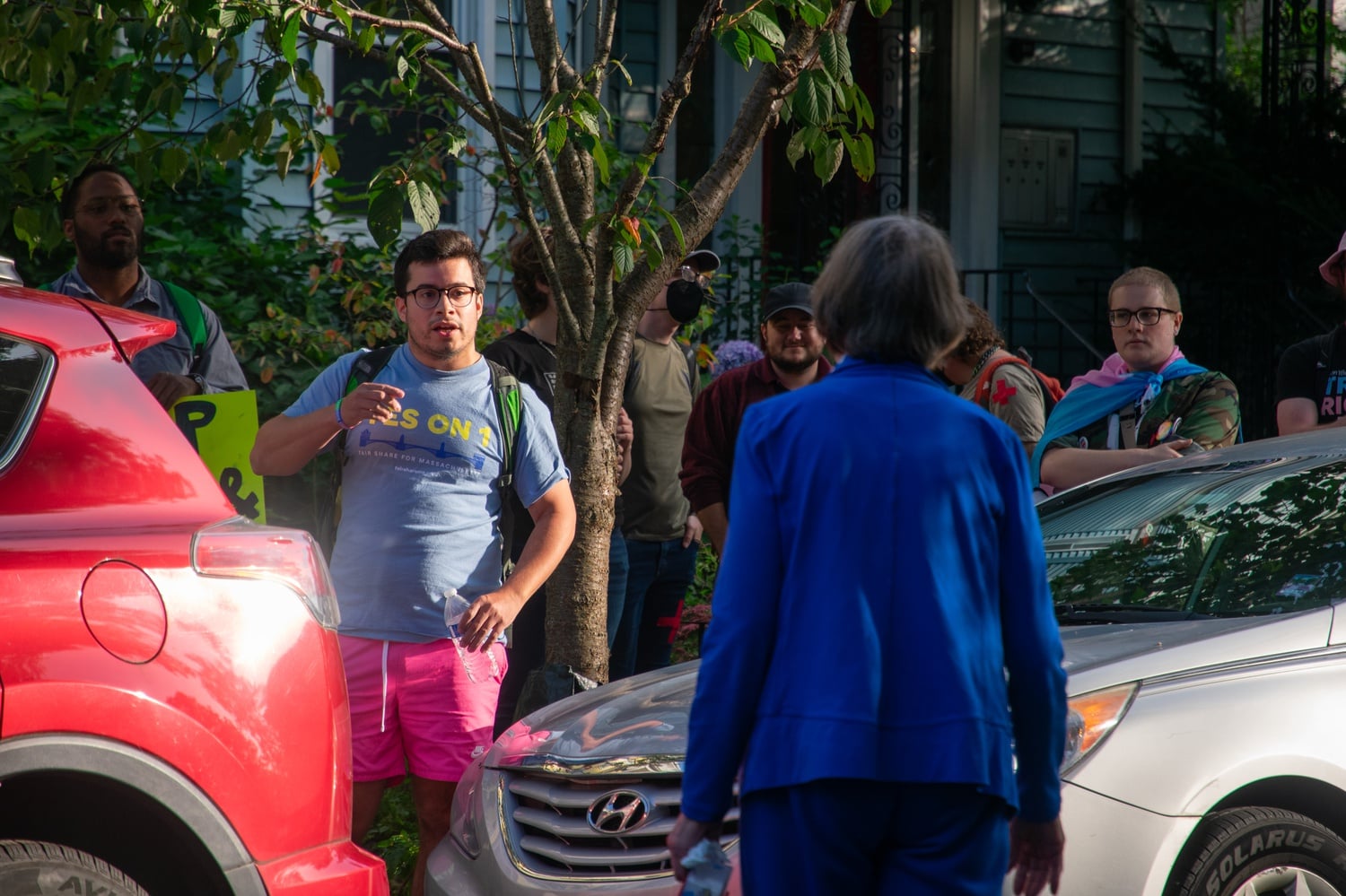 Cambridge City Council candidate Dan J. Totten argues event host Sara Mae Berman about the group's endorsements of Robert Winters and Carrie Pasquarello.