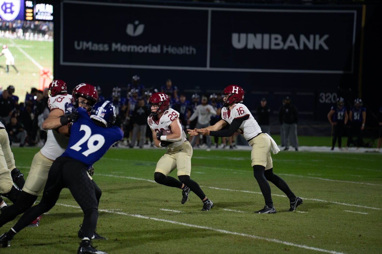 Junior running back Shane McLaughlin takes the handoff from junior quarterback Charles Deprima on September 30 at Holy Cross.