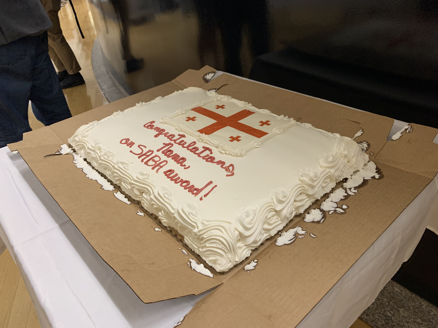 A cake congratulating Georgian novelist and literary scholar Nana Abuladze for winning an award. Though her books have been published in Georgian, Abuladze wrote much of her work for Exchanging Notes in English.