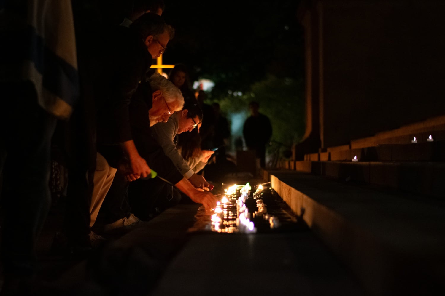 Harvard affiliates lit candles on the steps of Widener Library at a Sunday evening vigil for victims of the invasion by Hamas.