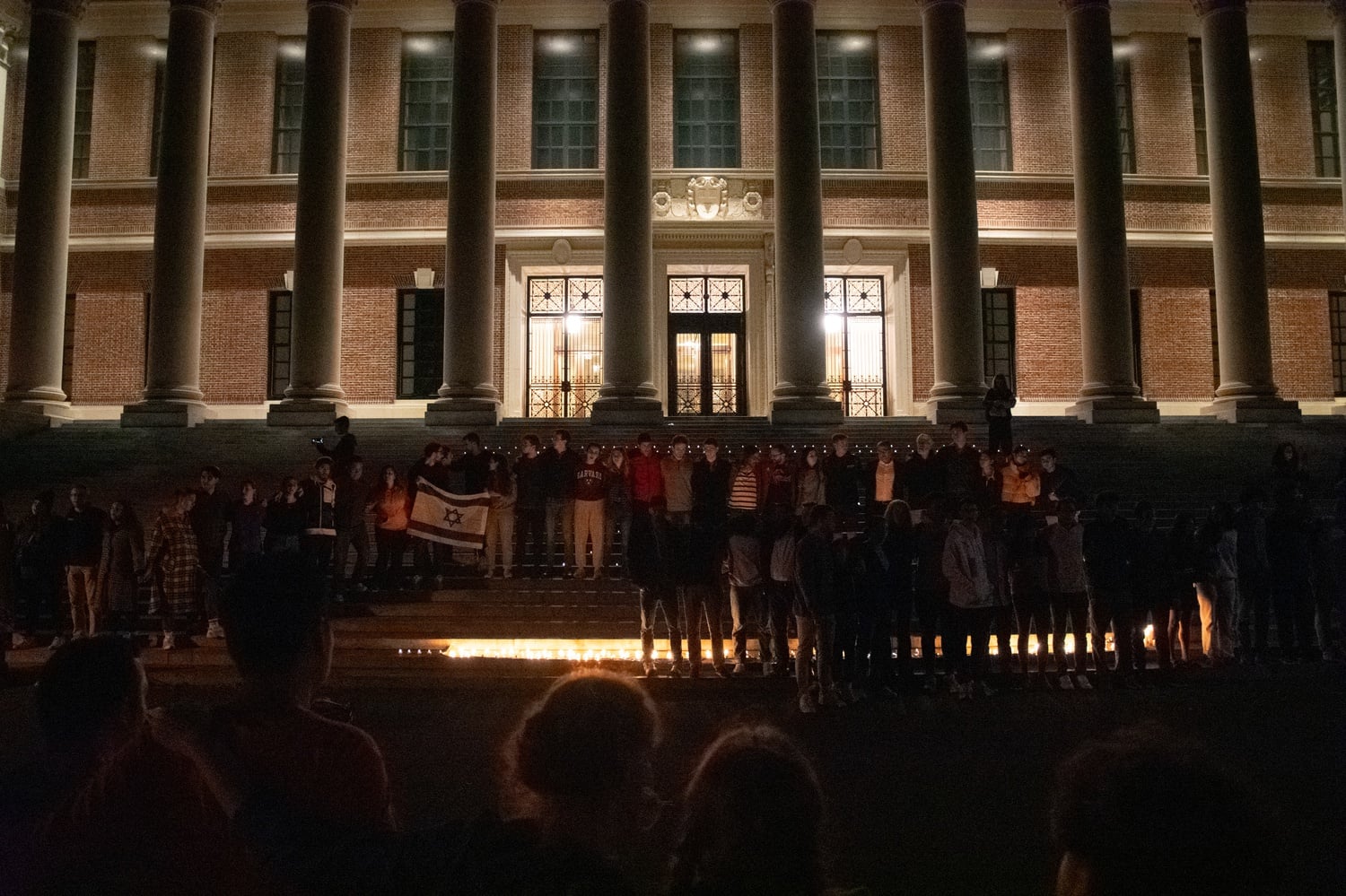 Vigil attendees stood on the steps of Widener Library and sang traditional Jewish songs at the end of the vigil.