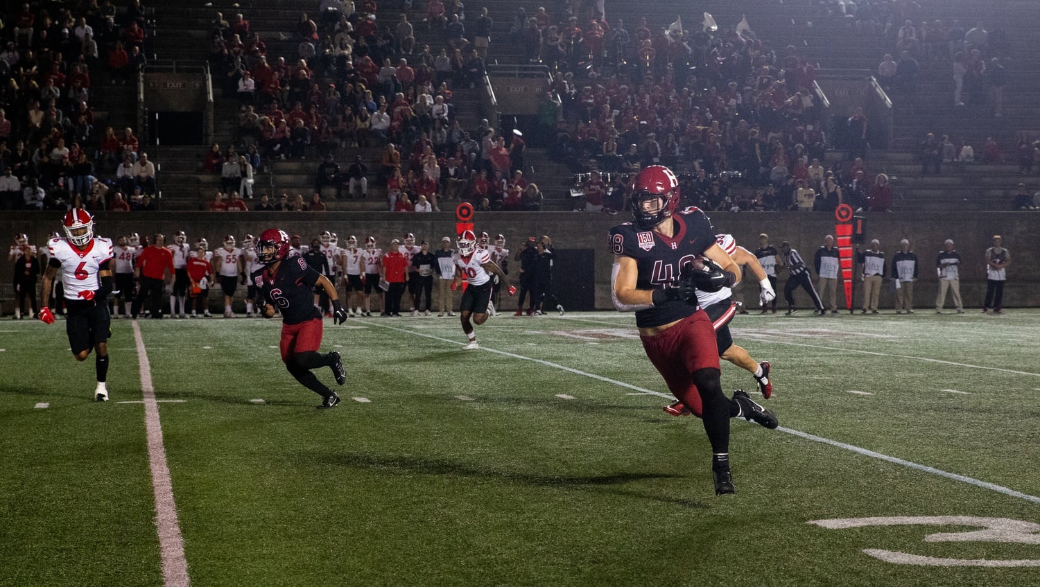 Senior tight end Tim Dowd runs the ball up the field in Harvard's second Ivy League game of the season on Oct. 6, facing Cornell. The Topsfield, Mass. local had a career high of 73-yards receiving.