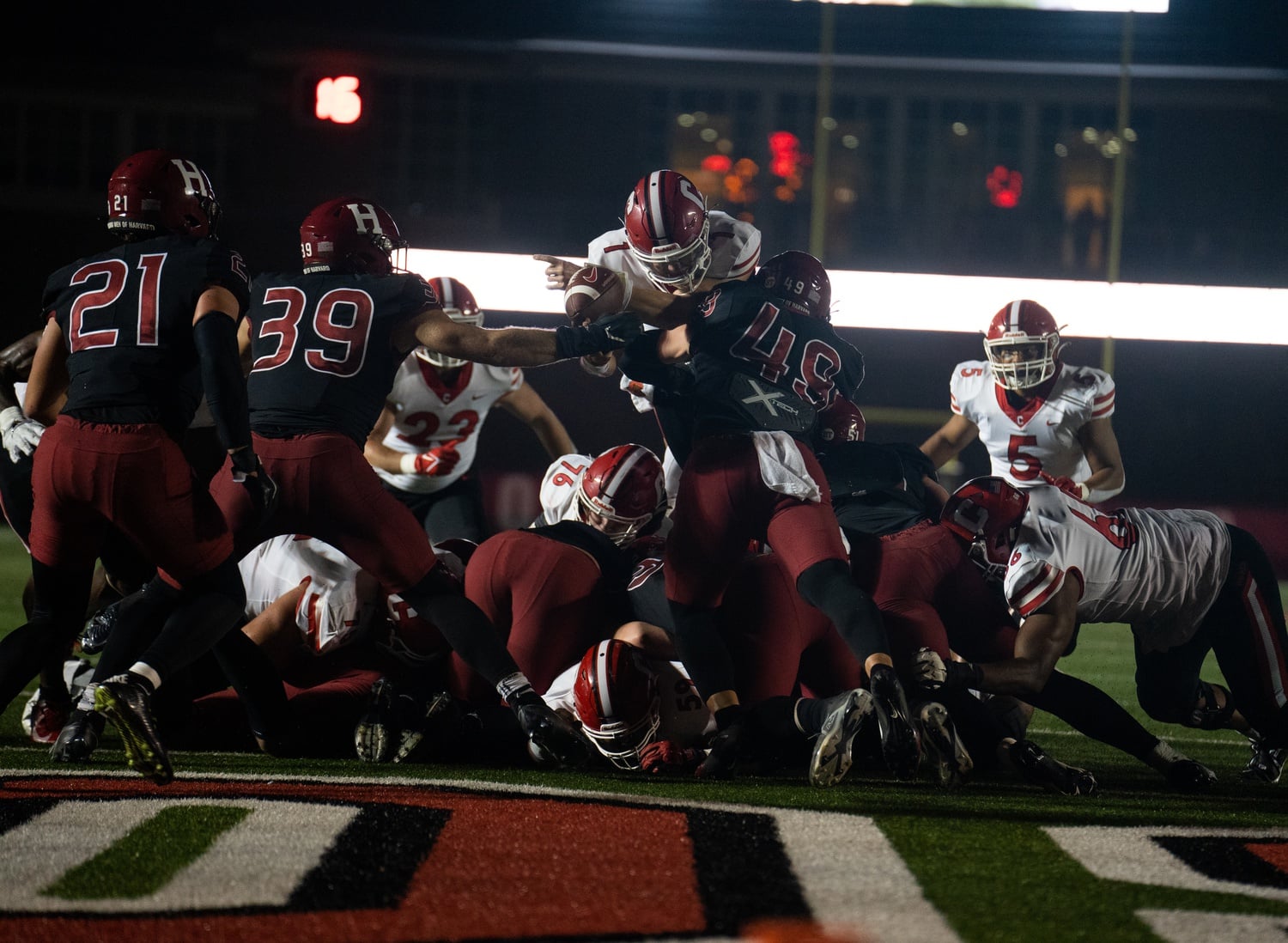 The Crimson defensive line battles to keep the Big Red behind the goal. The defense kept Cornell quarterback Jameson Wong to his fewest passing and rushing yards of the season.