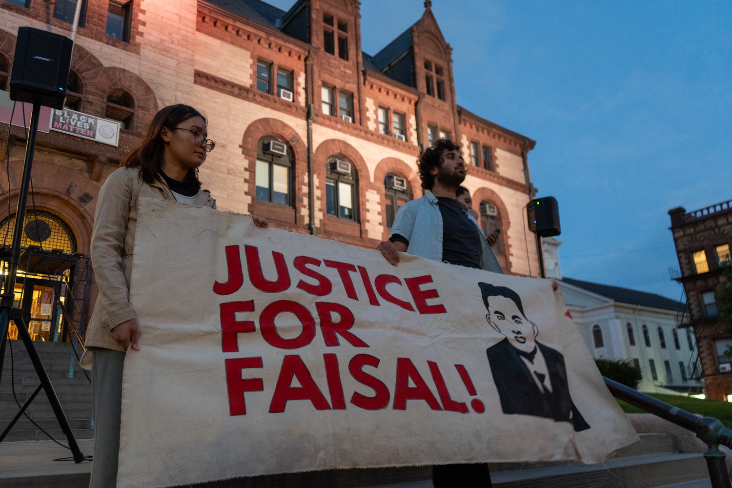 Dozens of protesters called for "Justice for Faisal" and the removal of the police officer who killed him at a demonstration at Cambridge City Hall Wednesday.