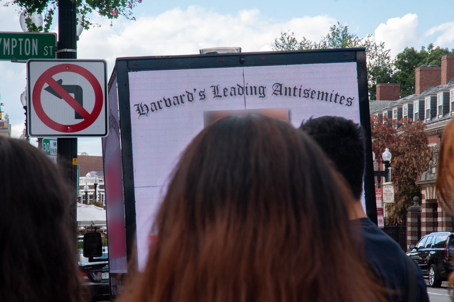 A billboard truck drove through the streets surrounding Harvard's campus in October, digitally displaying the names and faces of students allegedly affiliated with student groups that signed onto a controversial statement on Hamas' attack on Israel.