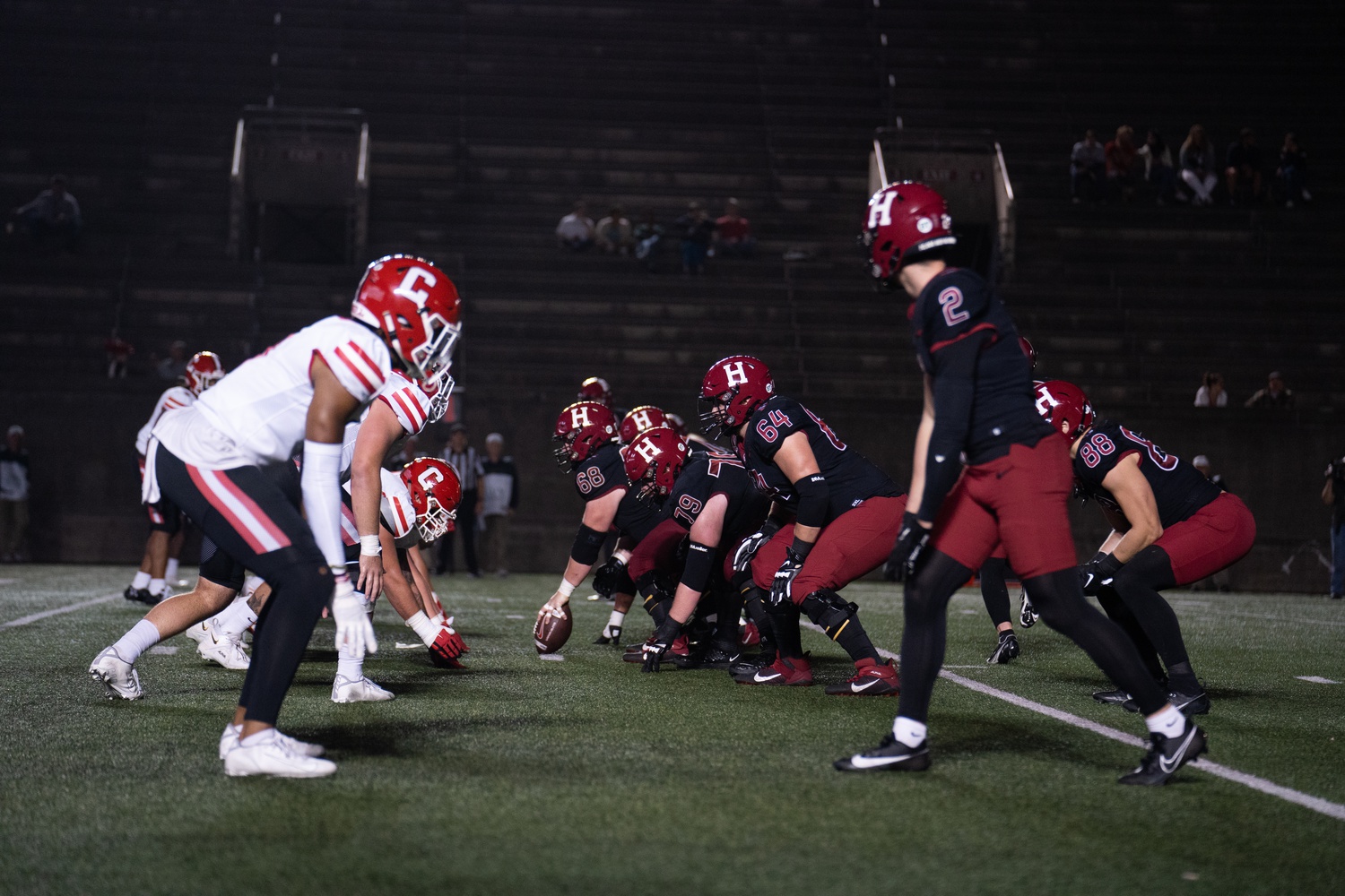 The Crimson offense lines up for a play against the Big Red last Friday, Oct. 6. Harvard beat its Ivy League counterpart in a 41-23 showdown.