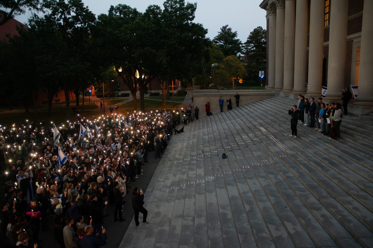 More than 1,000 people gathered by the steps of Widener Library on Oct. 15 for a vigil to stand in solidarity with Israel and mourn the civilian deaths.