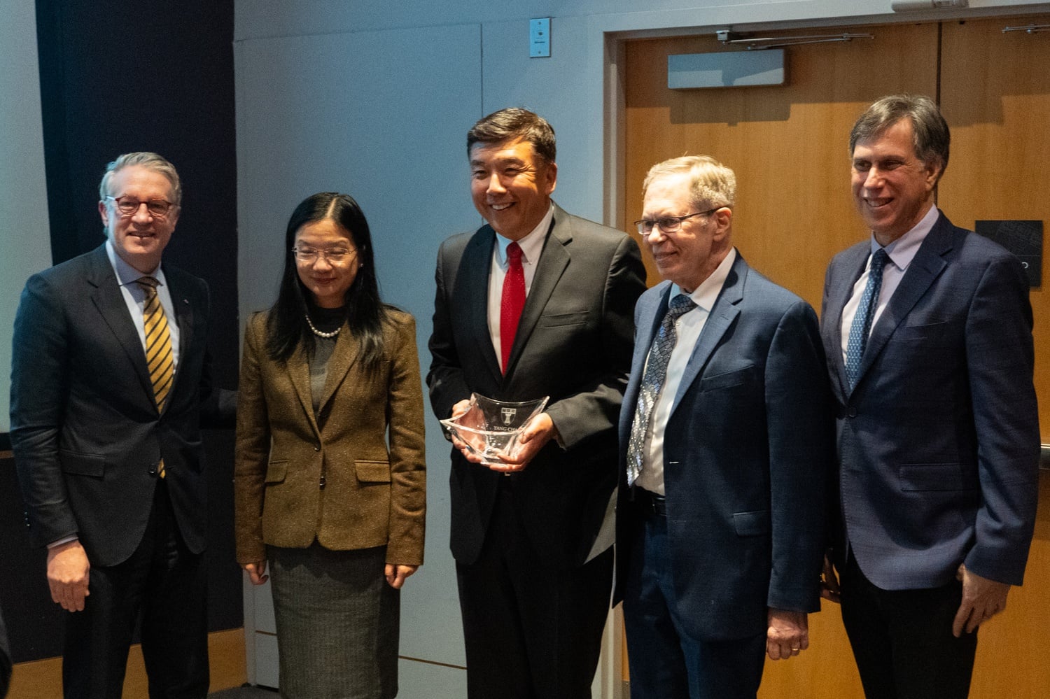 USC Professor Yang Chai holds the Goldhaber Award presented to him at the Harvard School of Dental Medicine.