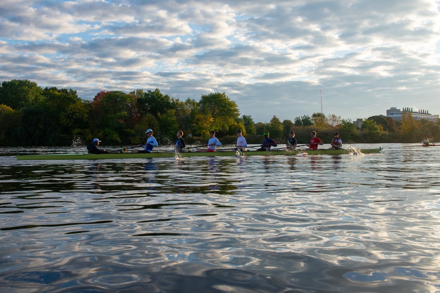 The Harvard men's heavyweight rowing team races along the Charles River during practice on October 19, 2023.