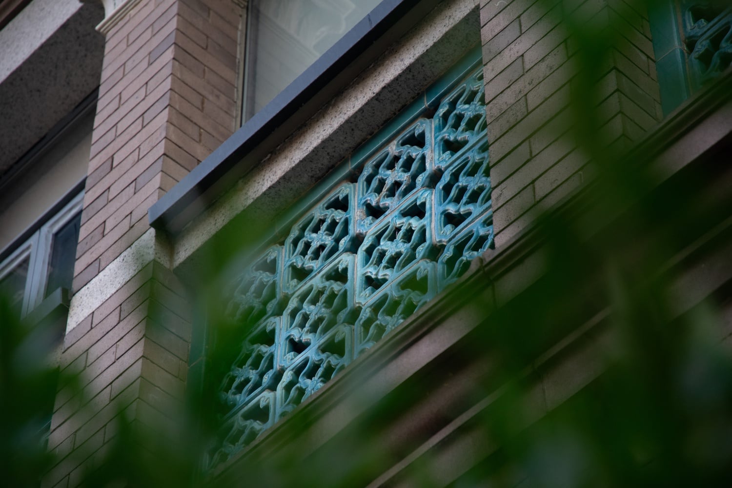 Annexed in the rear of the building is a stylistically unique rear porch. Constructed in 1897, this red brick portion of the house stands two stories tall and is adorned with glazed tile balustrades.