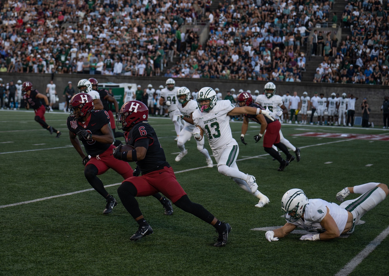 Junior wide receiver Scott Woods II drives the ball up the field. Harvard improved its record to 6-1, its best seven-game start since 2016.