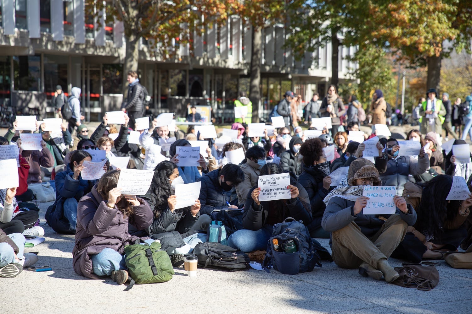 Harvard affiliates hold a sit-in at Science Center Plaza protesting Israeli airstrikes on a Gazan refugee camp.