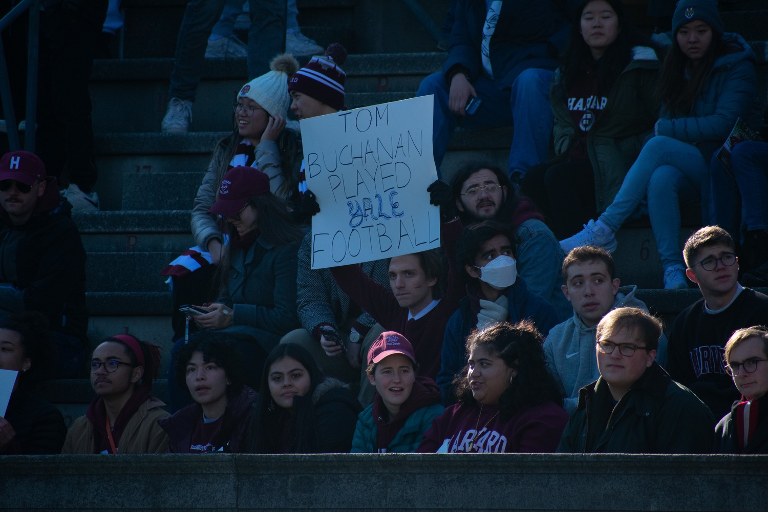 A Harvard students holds up a sign at the annual Harvard-Yale game back on Nov. 19, 2022 at Harvard Stadium. The Bulldogs ended up toppling the Crimson in a 19-14 affair.