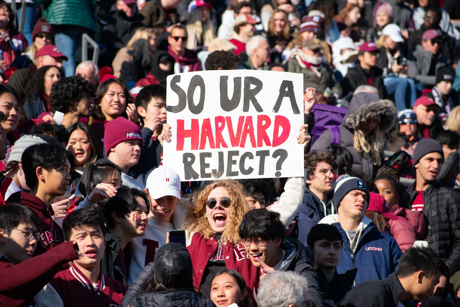 Harvard students hold signs and cheer on the university football team in last year's rendition of The Game in historic Harvard Stadium on Nov. 19, 2022.