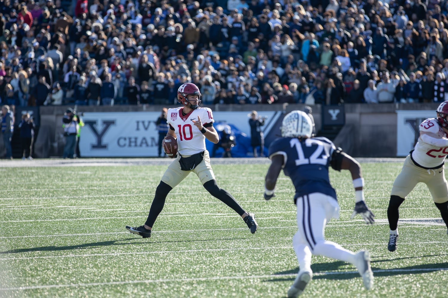 Sophomore quarterback Jaden Craig scrambles and looks to pass against the Yale Bulldogs during the 139th playing of The Game on November 18.