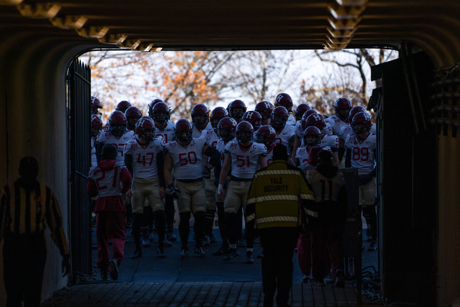 The Crimson return to the locker room during The Game. Harvard ended the season with an impressive 8-2 record overall, losing to Ivy foes Princeton and Yale.