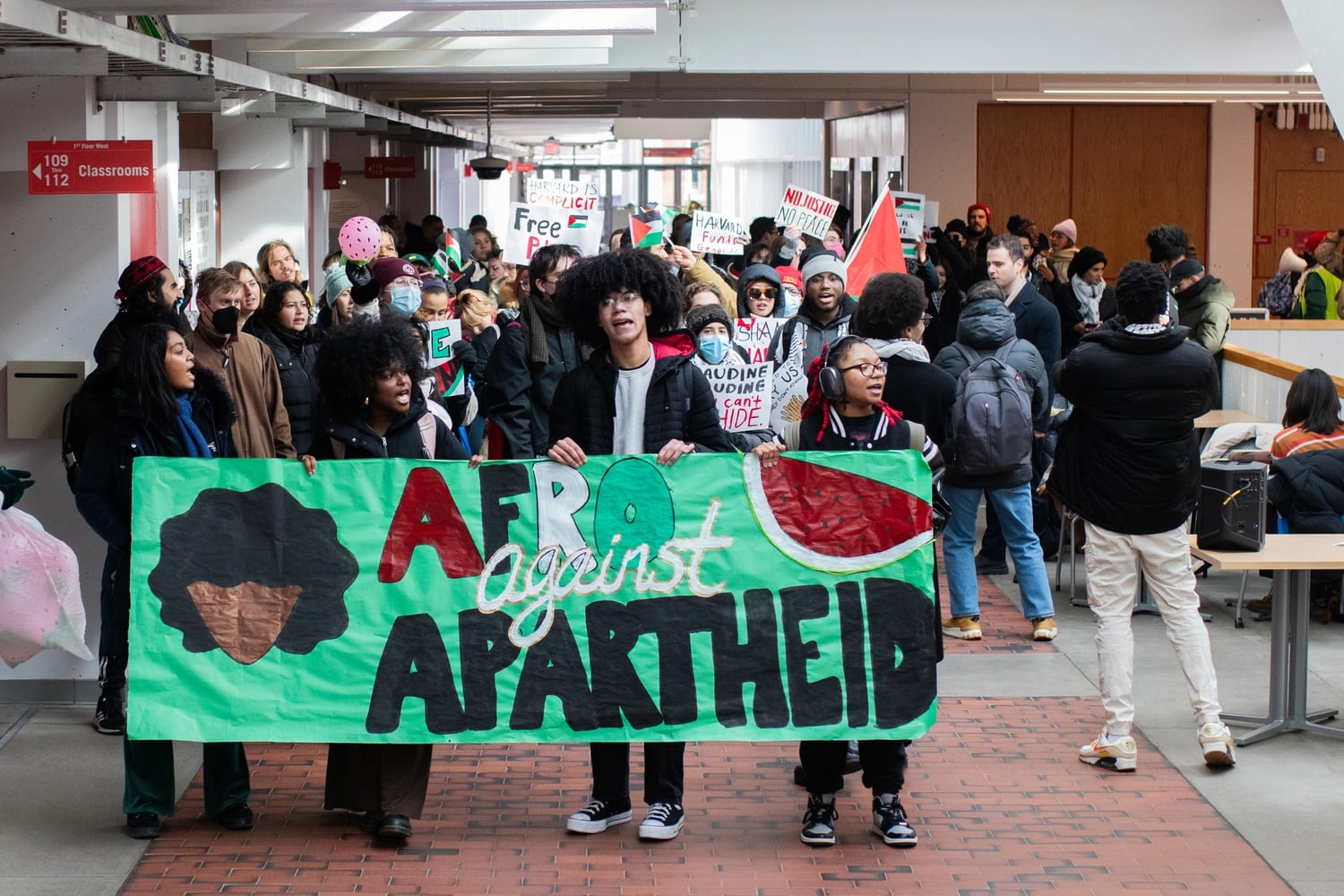 Protesters with the African and African American Resistance Organization march through the Science Center during a pro-Palestine week of action.