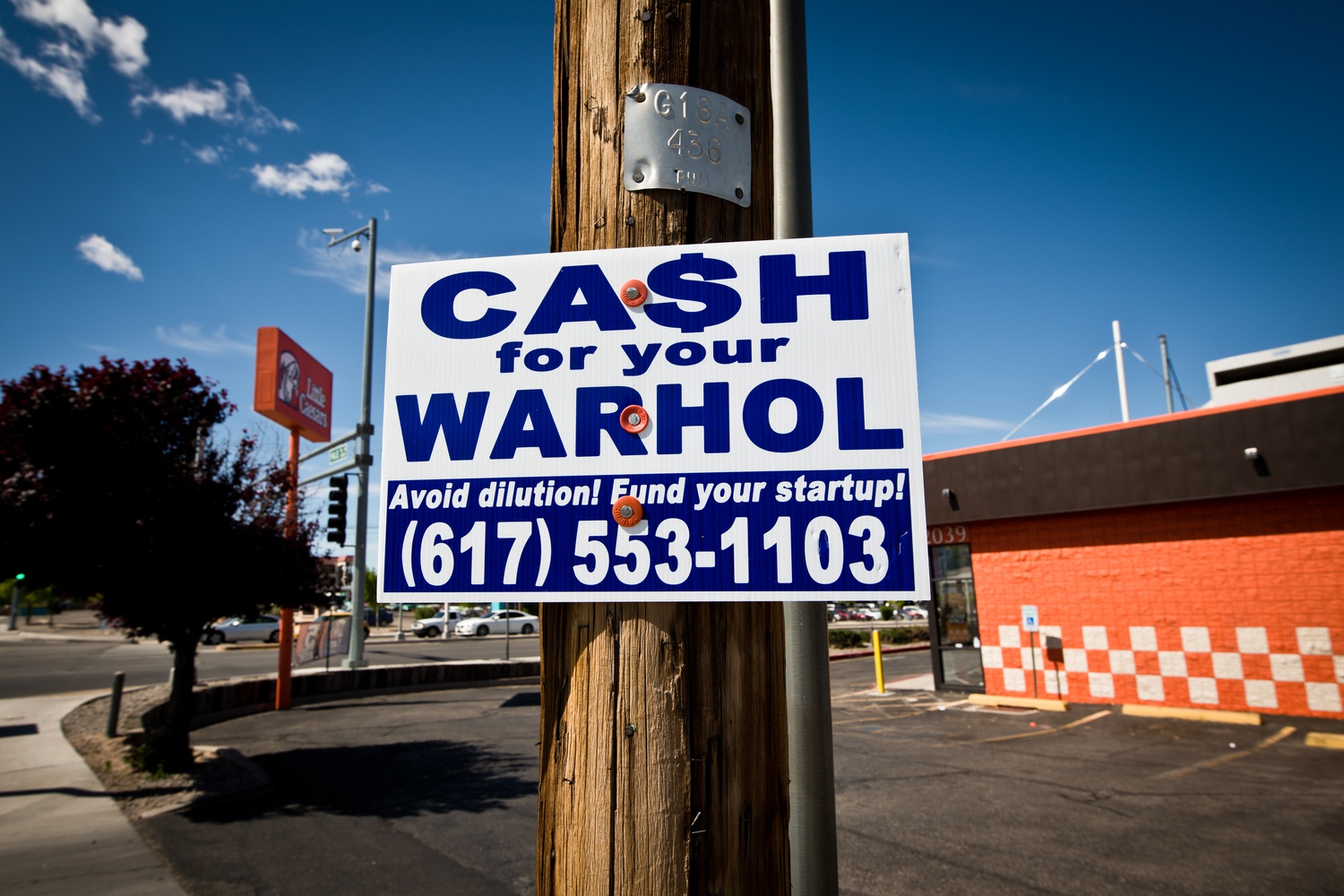A Cash for your Warhol sign posted in Albuquerque.