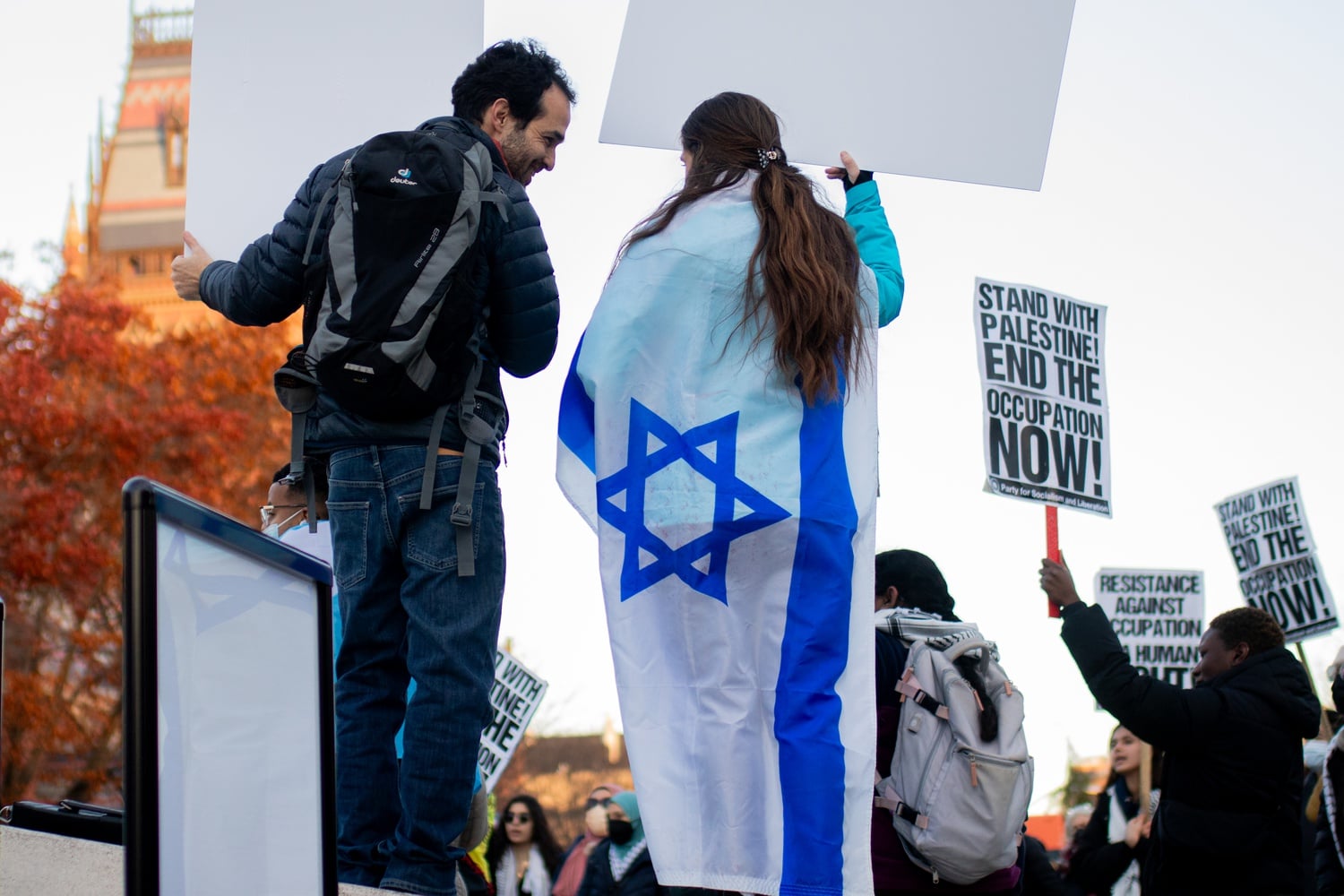 Counterprotesters hold an Israeli flag at the Monday Rally in the Science Center Plaza.