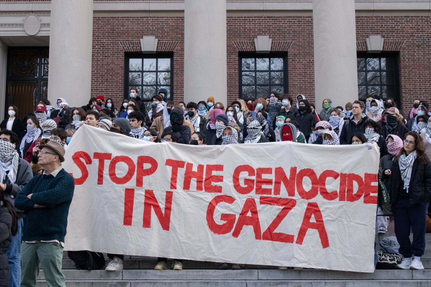 Nearly 200 students gathered on Widener steps demanding that Harvard disclose and divest its financial ties to "companies complicit in human rights abuses towards Palestinians."