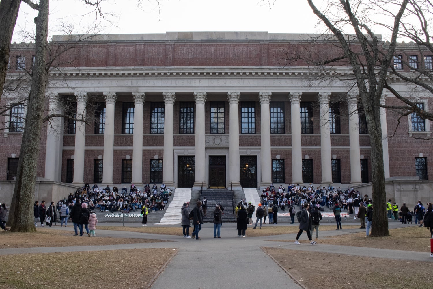 Harvard students gathered in front of Widener Library steps on Monday in protest of the airstrikes on Rafah.