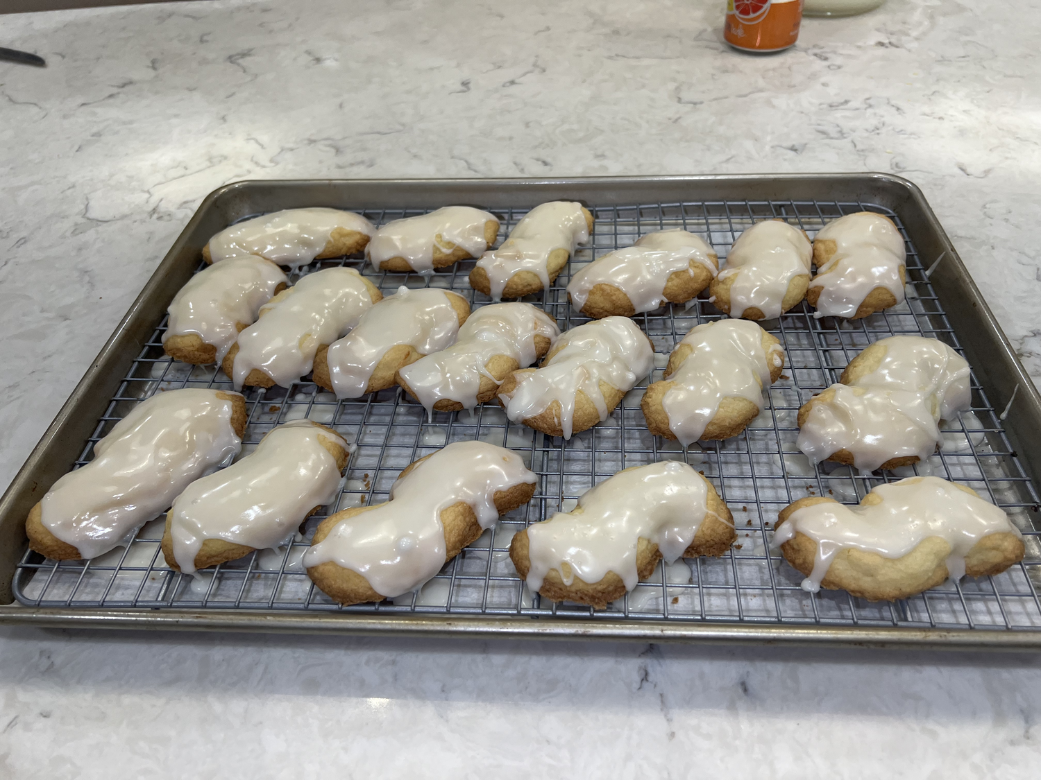 Fresh lemon zest and a tart simple icing cut the melt-in-your-mouth richness of the butter shortbread base to create a well-balanced cookie.