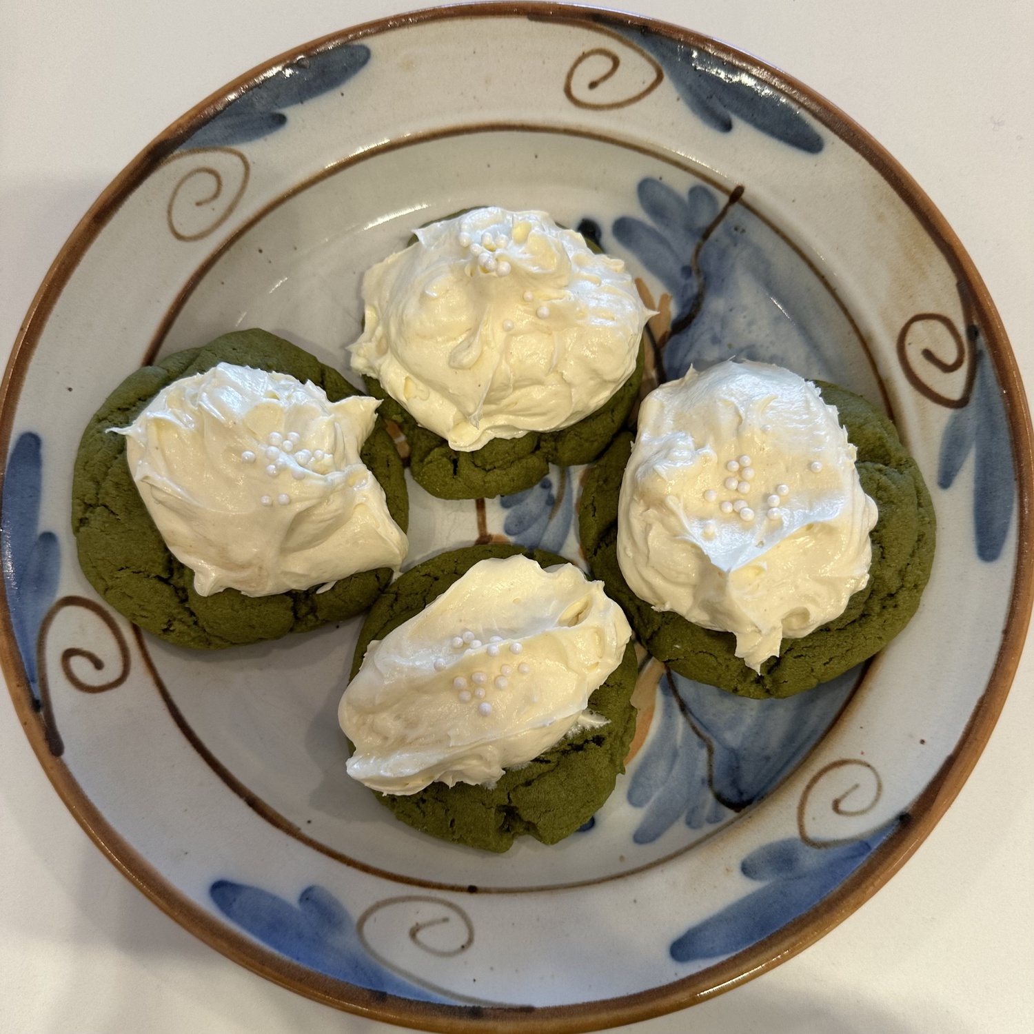 These subtle, not too sweet cookies are topped with a dollop of semi-sweet buttercream, beautifully reminiscent of the foam of a latte.