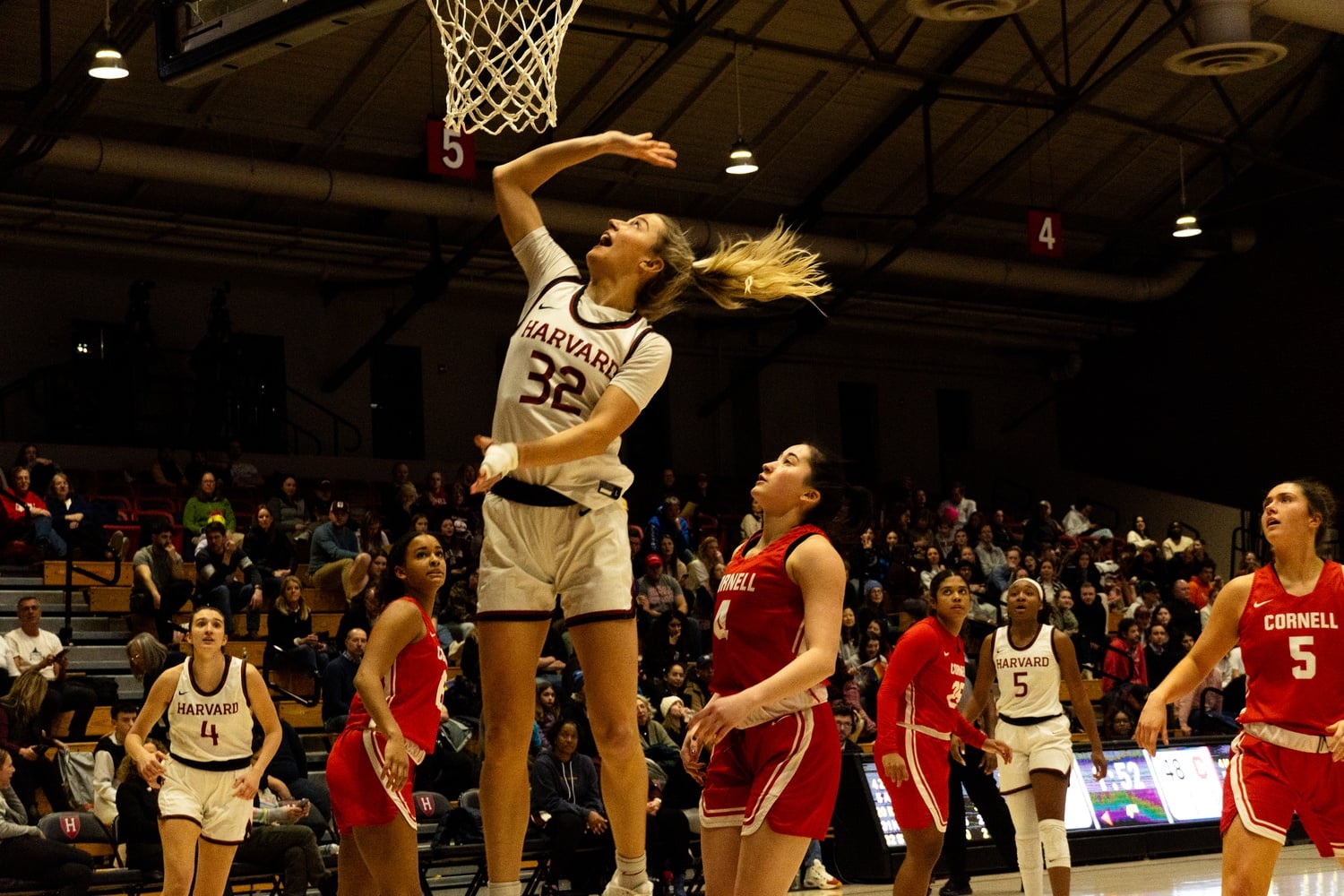 Junior Elle Stauffer goes up to defend the basket in a game against Cornell. The Crimson came away with a decisive victory over the Big Red.