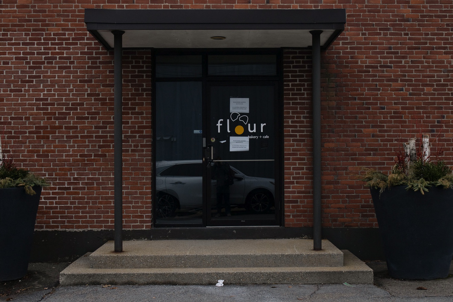 The building at 9 Travis St, which once held a commercial kitchen for Flour Bakery + Cafe, has been empty since 2018.