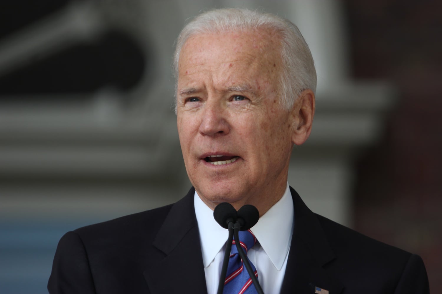 Joe Biden speaks at Harvard College's Class of 2017 Commencement. Massachusetts voters are set to head to the polls on Tuesday along with 16 other states and territories holding presidential primary elections on what is known as Super Tuesday.