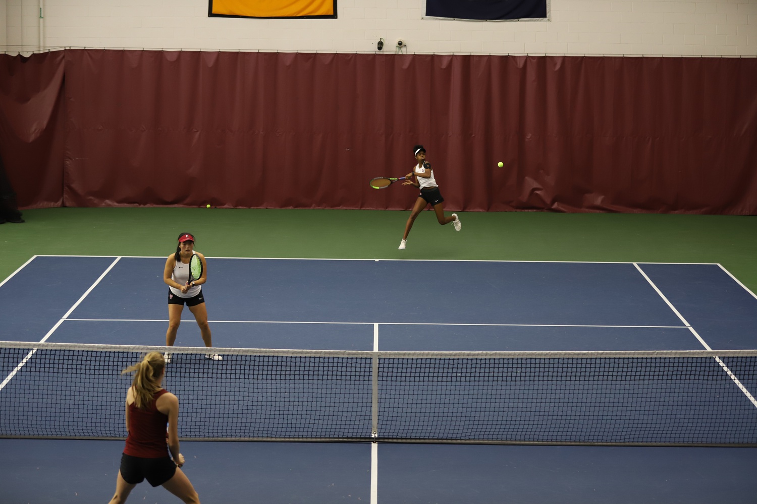 Junior Maxi Duncan uncorks a forehand in a match against BC. Duncan teamed up with Holly Fischer this weekend to great success.