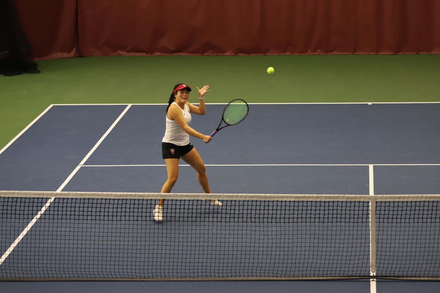 Junior co-captain Angel You hits a volley in a 2021 match-up with BC. You helped lead the team to two victories this past weekend.