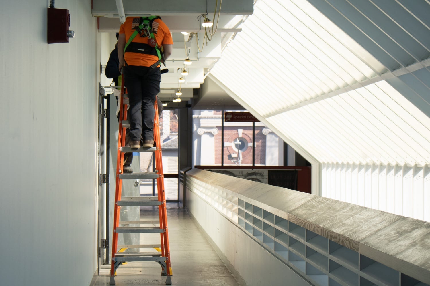 A worker stands on a ladder on the second floor of the Science Center. Renovations in the complex have frustrated some students who take classes there.
