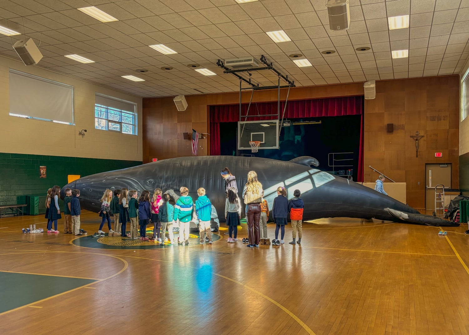 Children line up to enter the Whalemobile.