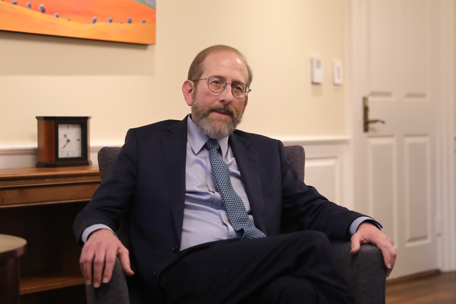 Interim Harvard President Alan M. Garber '76 is pictured in his office in a February interview. Garber announced an "Institutional Voice Working Group" on Thursday as Harvard moves closer to a policy of institutional neutrality.