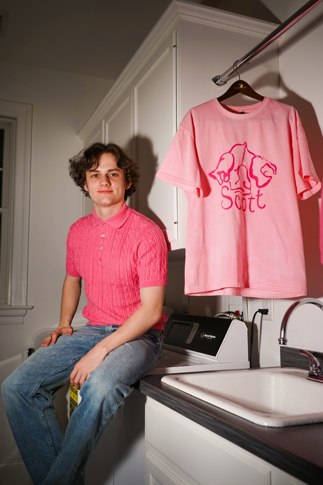 Finn O. Glew '25 with Commodore Scott merchandise.