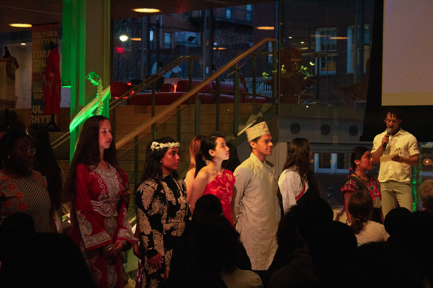 Models walked down the catwalk in pairs, each wearing their respective cultural attire.