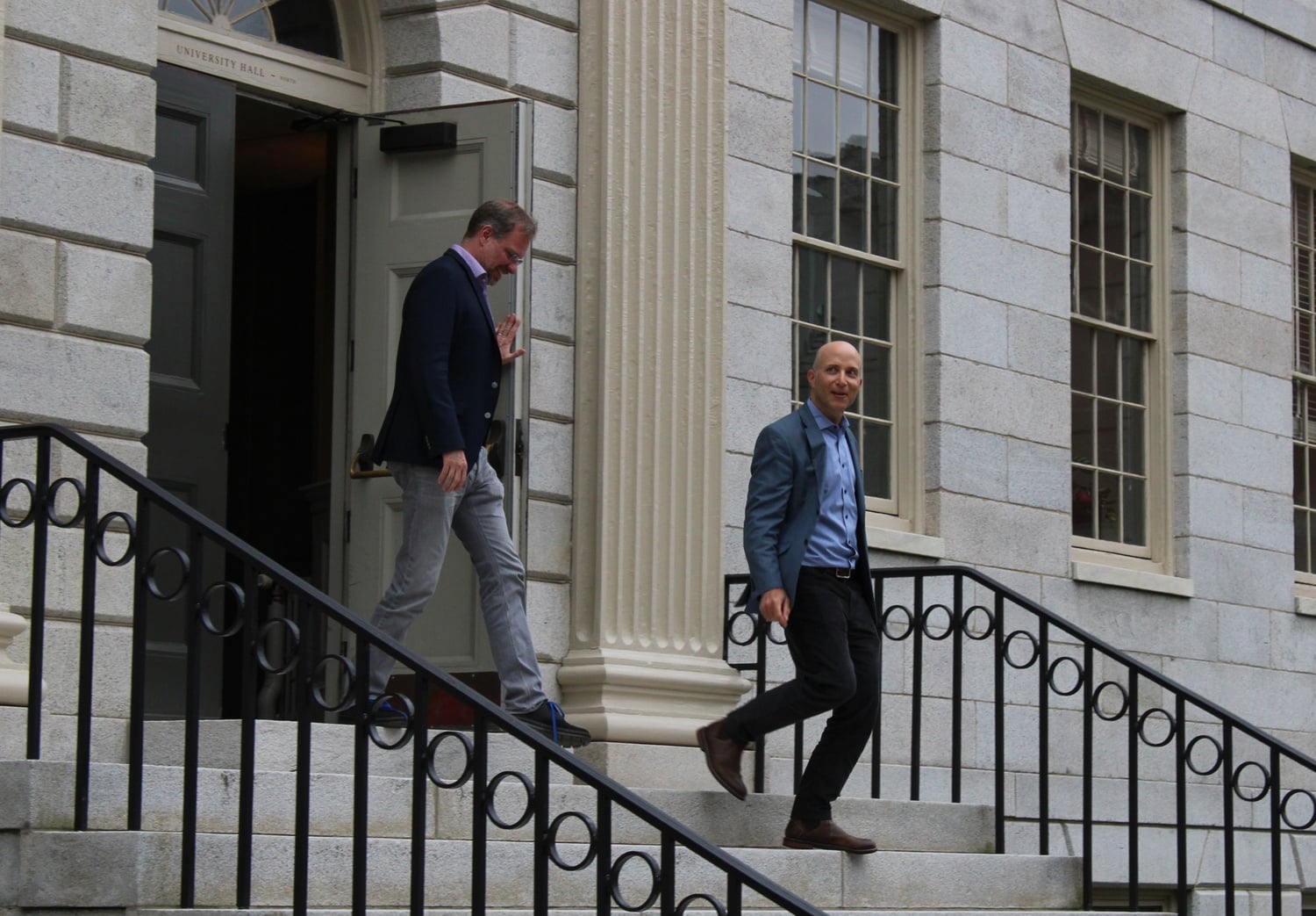 Faculty members leave University Hall after the April Faculty of Arts and Sciences meeting.