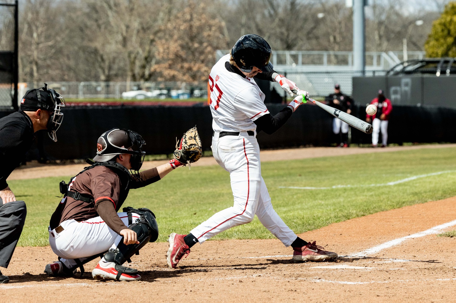 Senior first baseman Chris Snopek prepares to square up a pitch in a game last weekend against Brown. Snopek drove in five against BC, but Harvard still couldn't complete the comeback.
