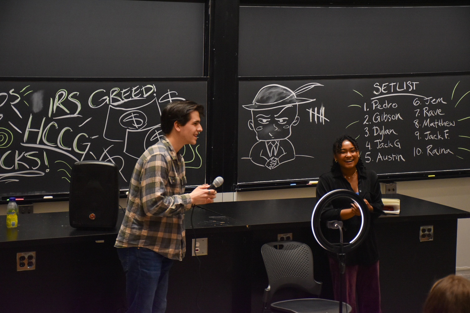 HUSUCS presidents, John “Jack” F. Griffin ’25 and Rave S. Andrews ’25, lead a meeting for the stand-up group on March 30.