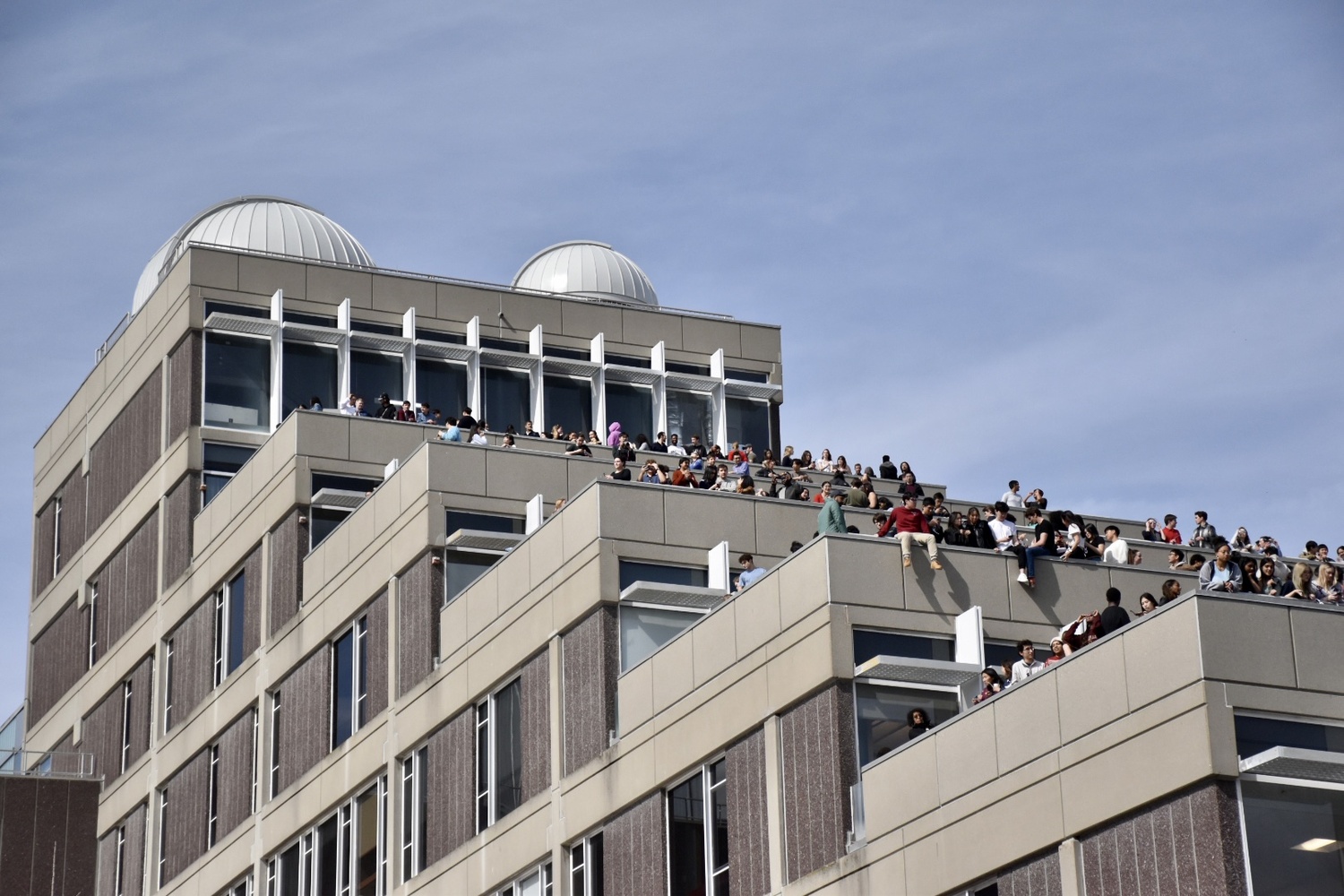 Students gather on the Science Center's balconies to watch the eclipse.