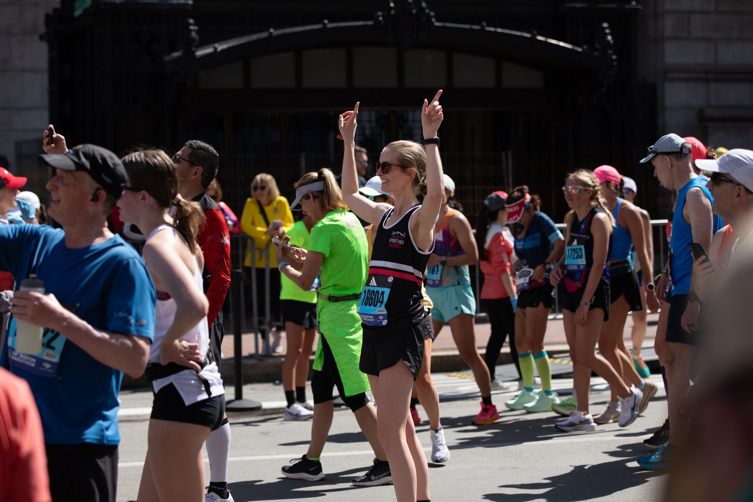 A runner celebrates after crossing the finish lane at the 128th Boston Marathon on Monday.