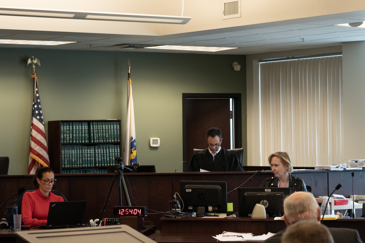 John P. Pappas (center) presides over trial. Carrie E. Landa, Boston University's executive director for student wellbeing, testified that CAMHS employee Melanie G. Northrop's lack of summer contact was normal.