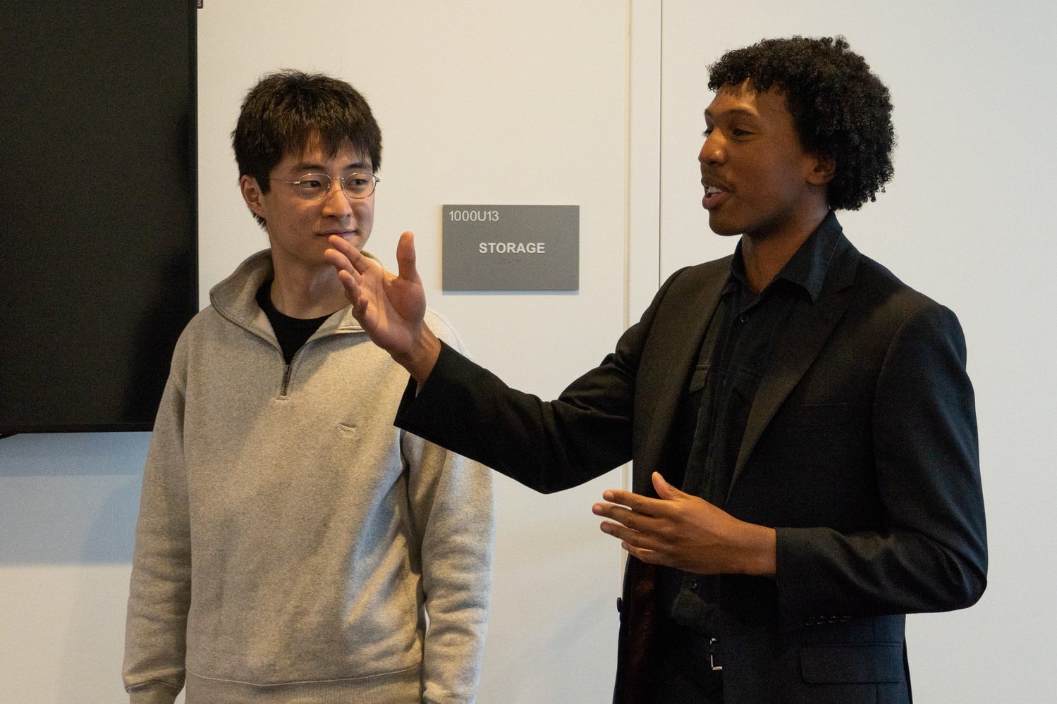 Harvard Undergraduate Association Presidents John S. Cooke '25 (right) and Shikoh M. Hirabayashi '24 (left) speak at an HUA meeting. The HUA's Election Committee announced Sunday evening that a petition was filed for a vote to recall Hirabayashi.