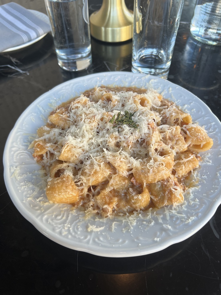 As for the food, the rigatoni bolognese stands out as a particularly delectable option on the menu.